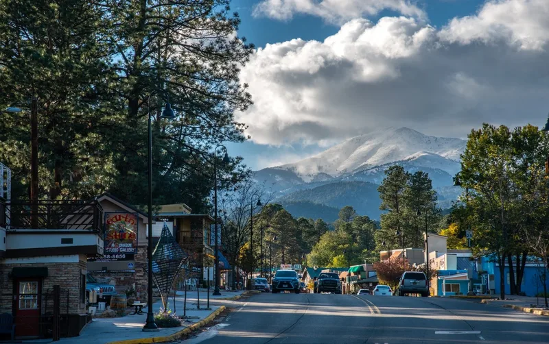 Midtown Ruidoso street beneath tall pines
