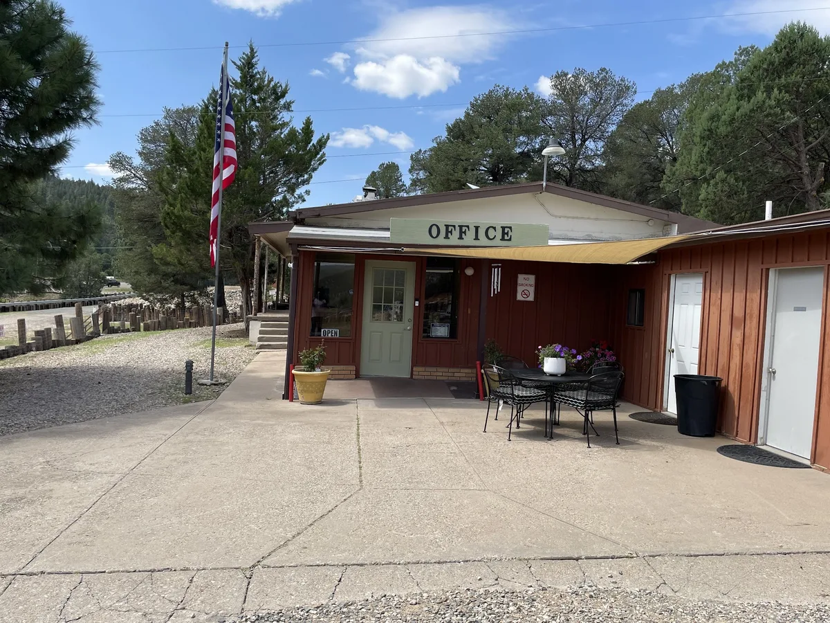 Park office with an American flag and patio chairs