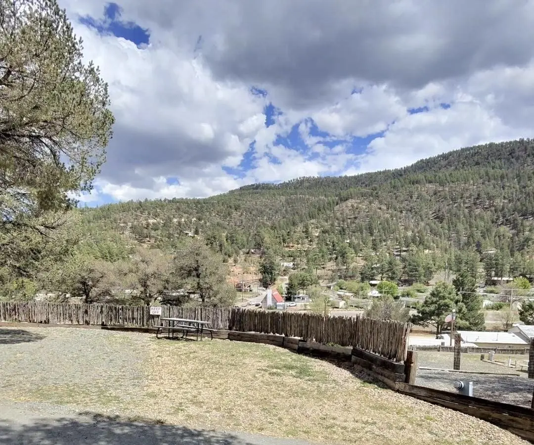 View across the park toward the wooded Ruidoso hills